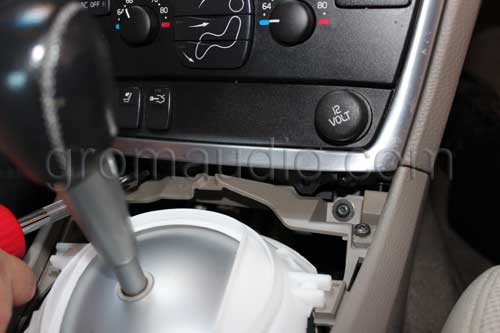 Remove the two screws on the bottom  of the center console